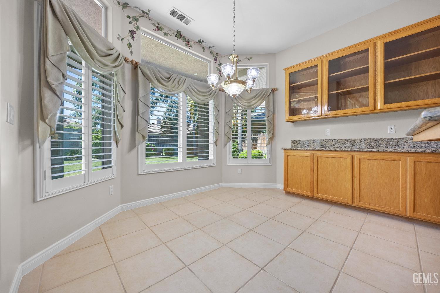 Undisclosed Address Bakersfield, CA 93312 - Photo 19 of 45 a view of an empty room with a window