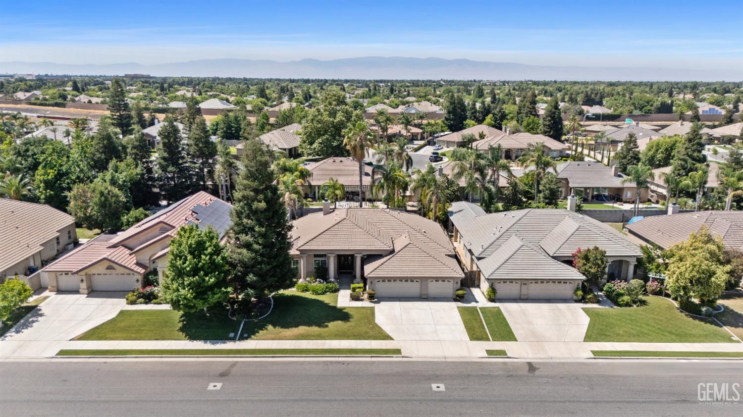 Undisclosed Address Bakersfield, CA 93312 - Photo 2 of 45 an aerial view of a house with garden space and street view