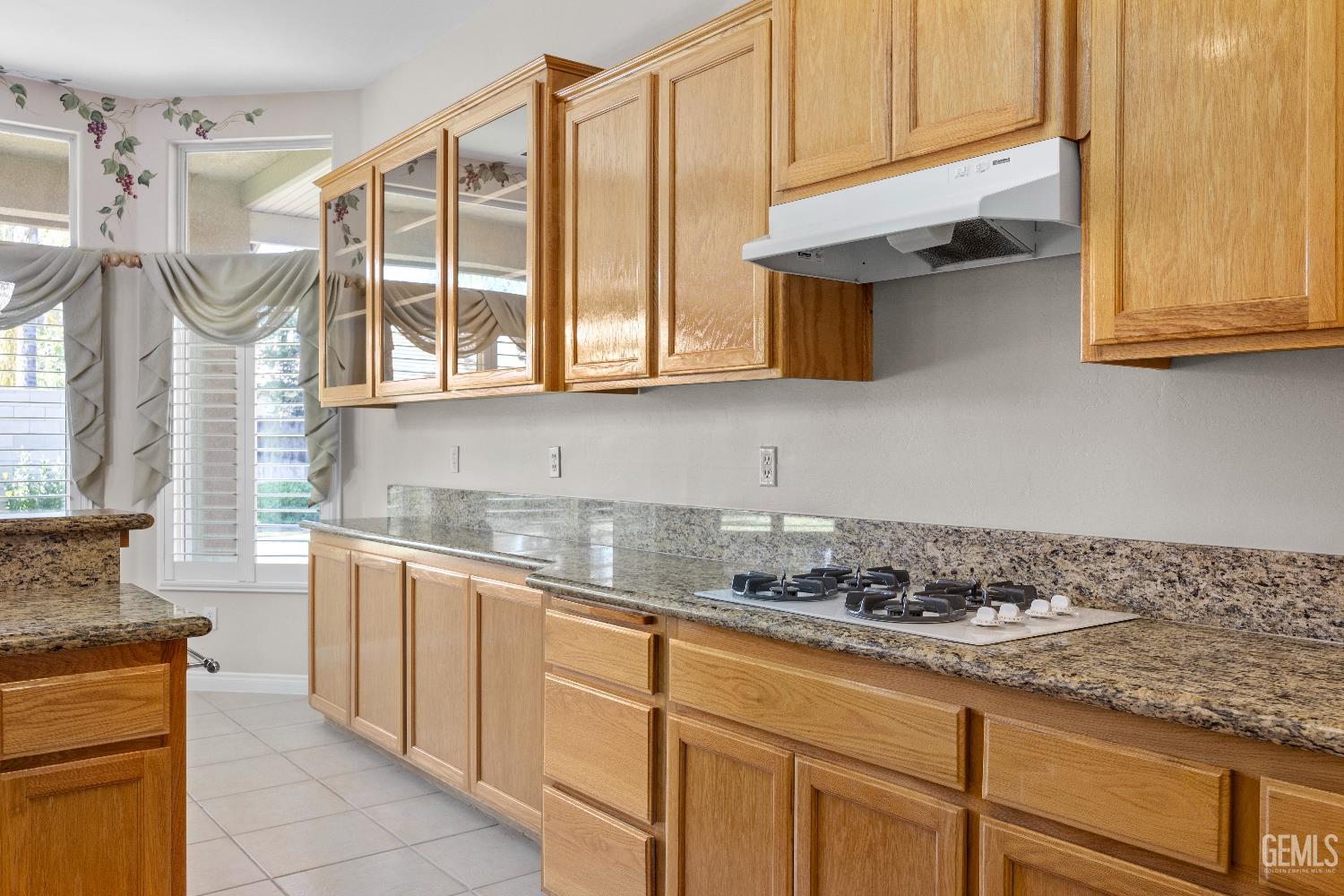 Undisclosed Address Bakersfield, CA 93312 - Photo 21 of 45 a kitchen with stainless steel appliances granite countertop a sink a stove and cabinets