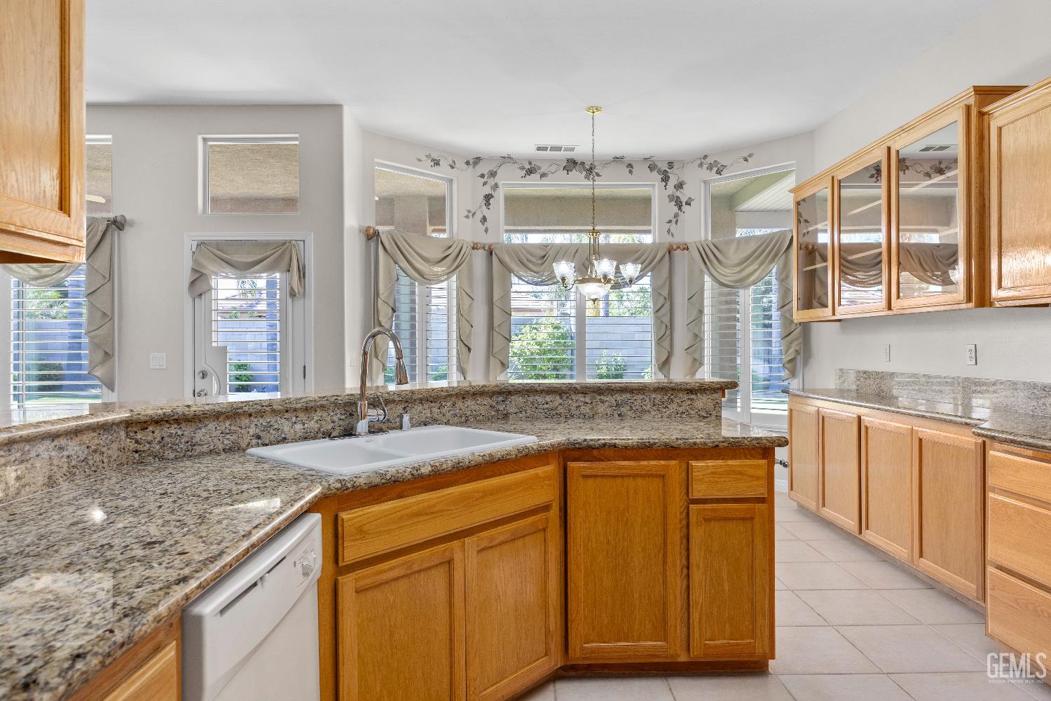 Undisclosed Address Bakersfield, CA 93312 - Photo 23 of 45 a bathroom with granite countertop a sink and a window
