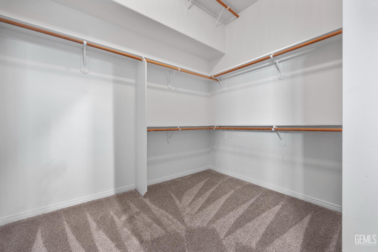 Undisclosed Address Bakersfield, CA 93312 - Photo 28 of 45 a view of an empty walk in closet