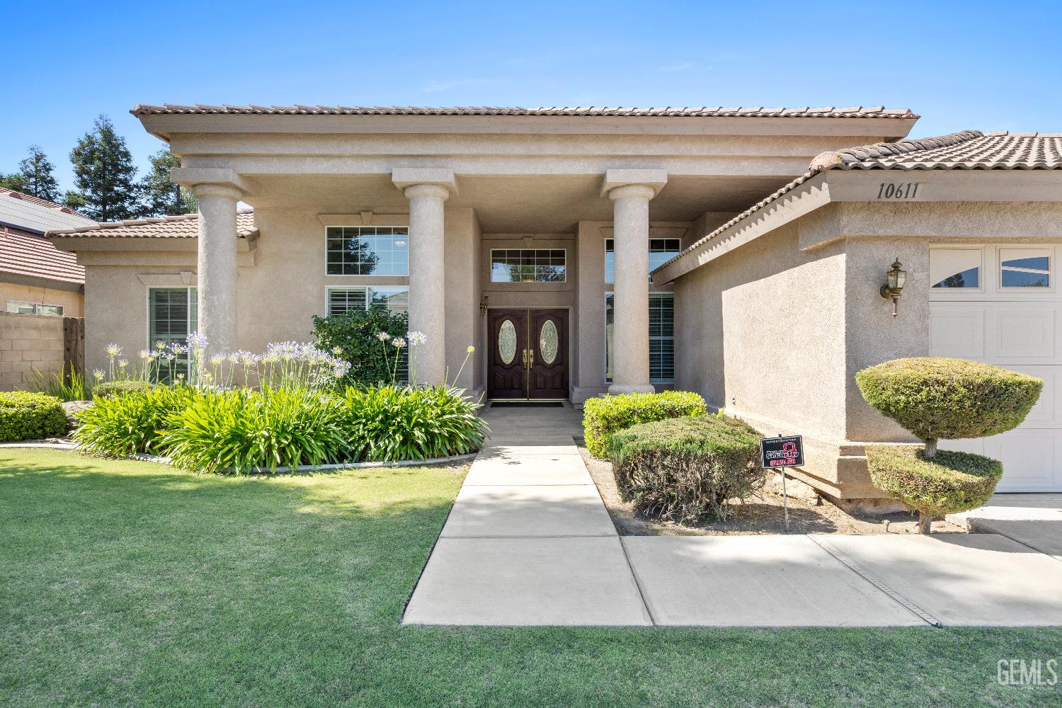 Undisclosed Address Bakersfield, CA 93312 - Photo 3 of 45 a front view of a house with garden