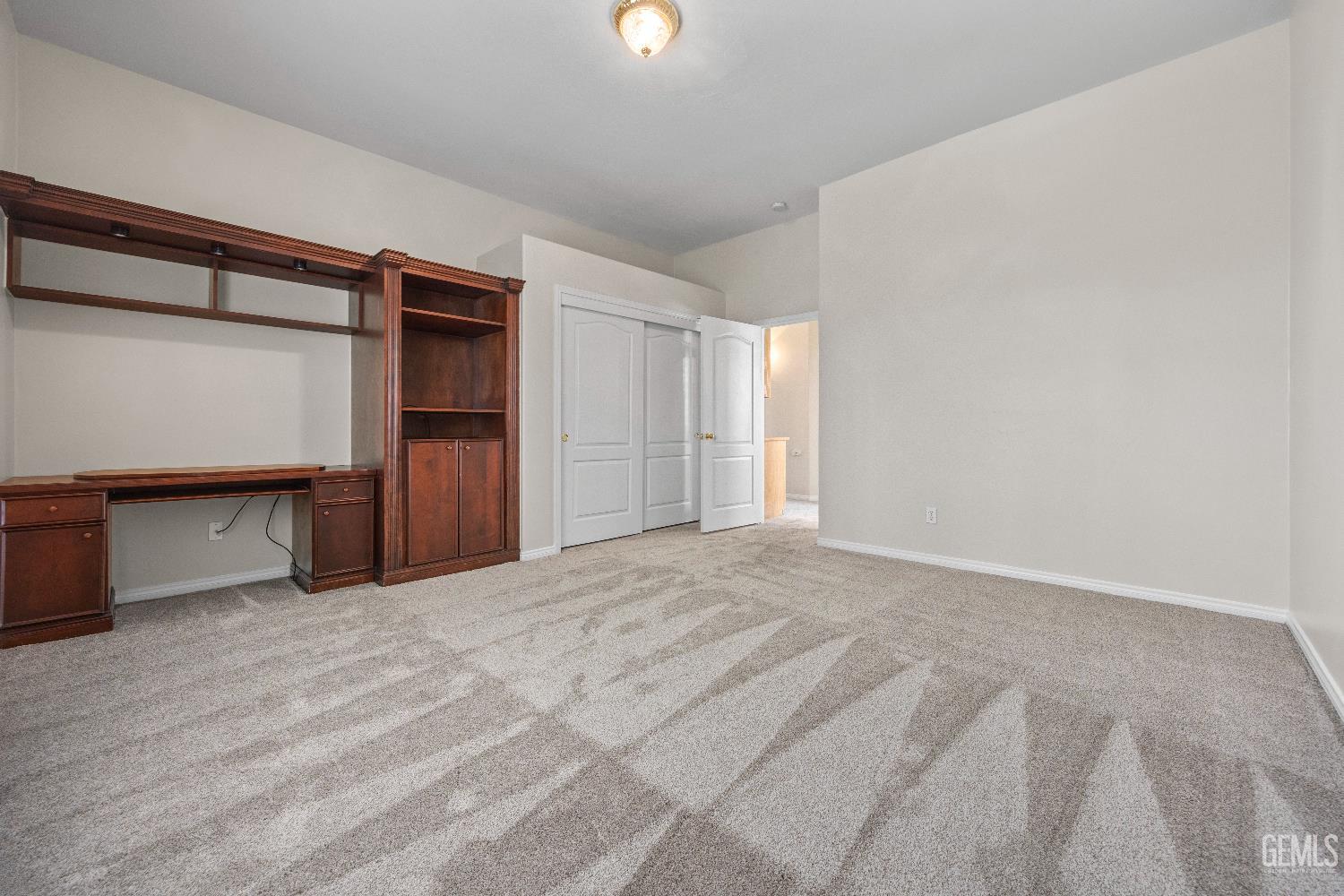 Undisclosed Address Bakersfield, CA 93312 - Photo 32 of 45 a view of empty room with wooden floor