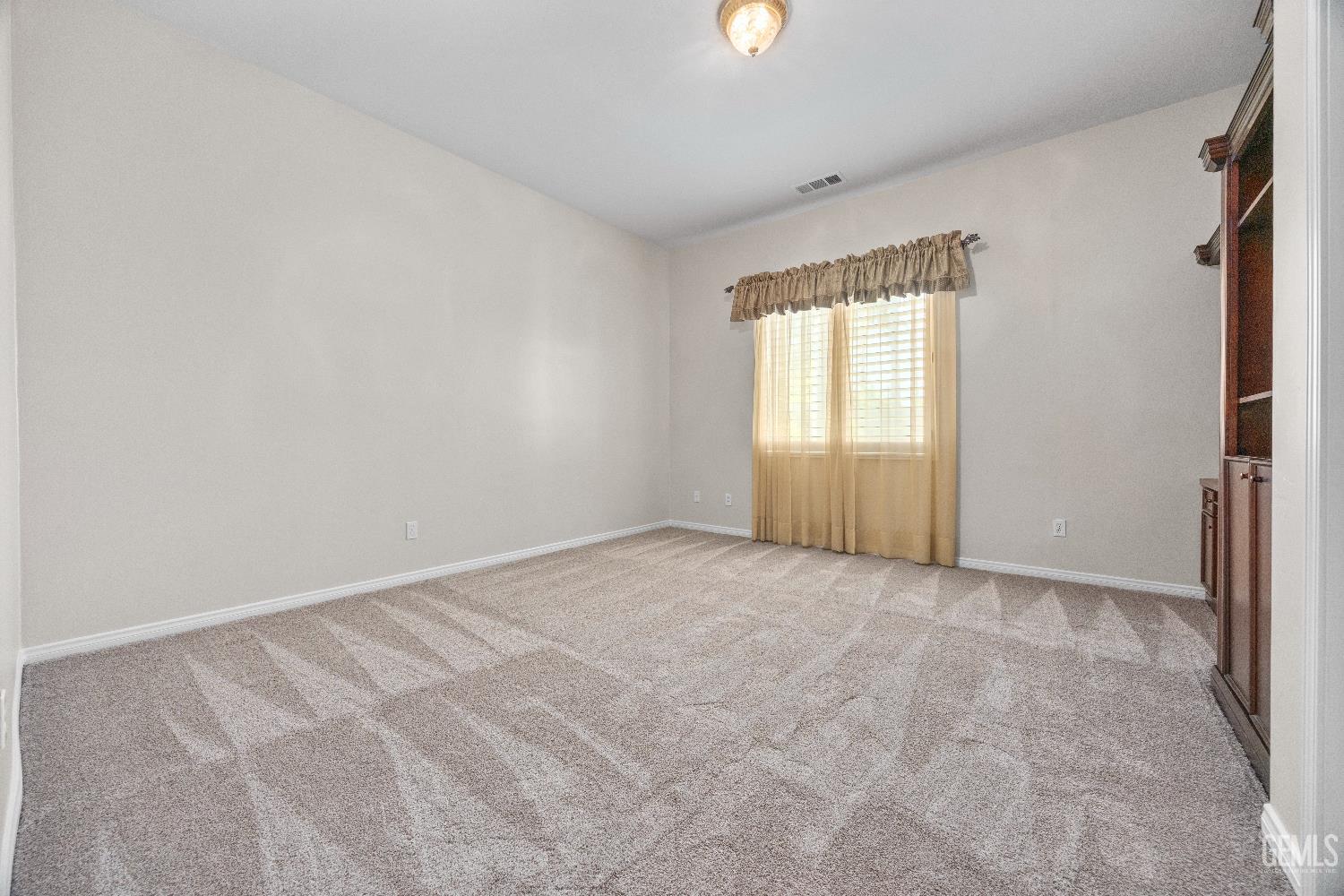 Undisclosed Address Bakersfield, CA 93312 - Photo 33 of 45 an empty room with windows