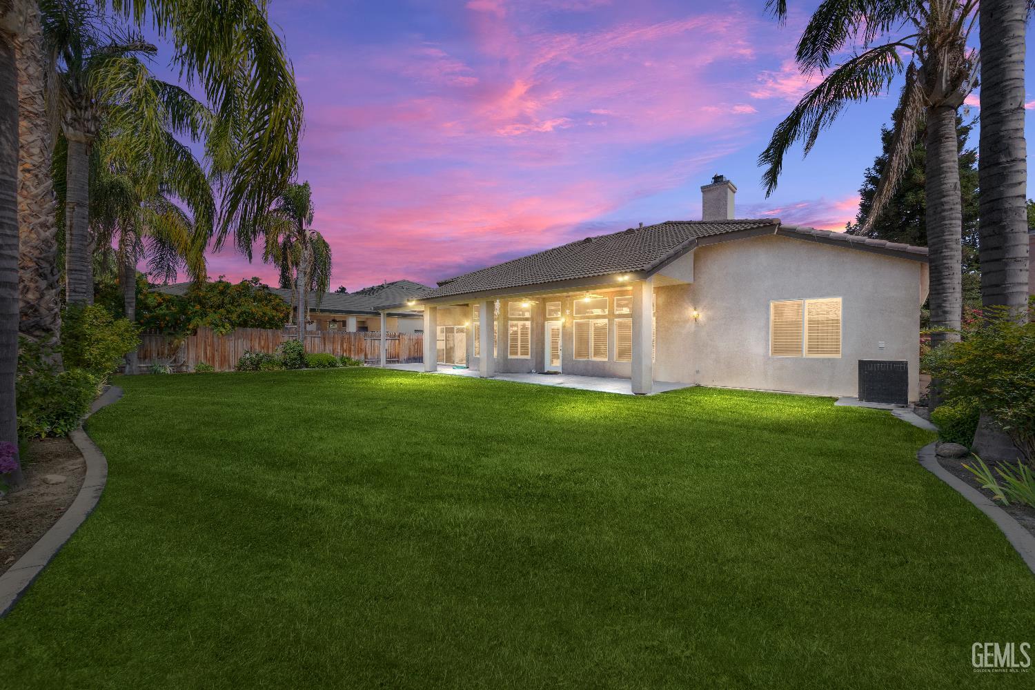 Undisclosed Address Bakersfield, CA 93312 - Photo 37 of 45 a front view of a house with a garden