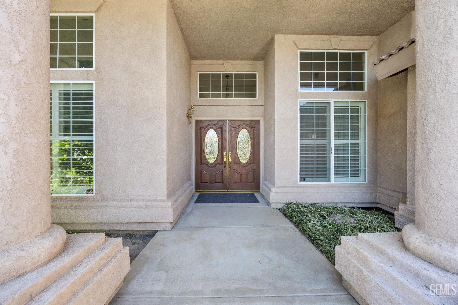 Undisclosed Address Bakersfield, CA 93312 - Photo 4 of 45 a front view of a house with a yard
