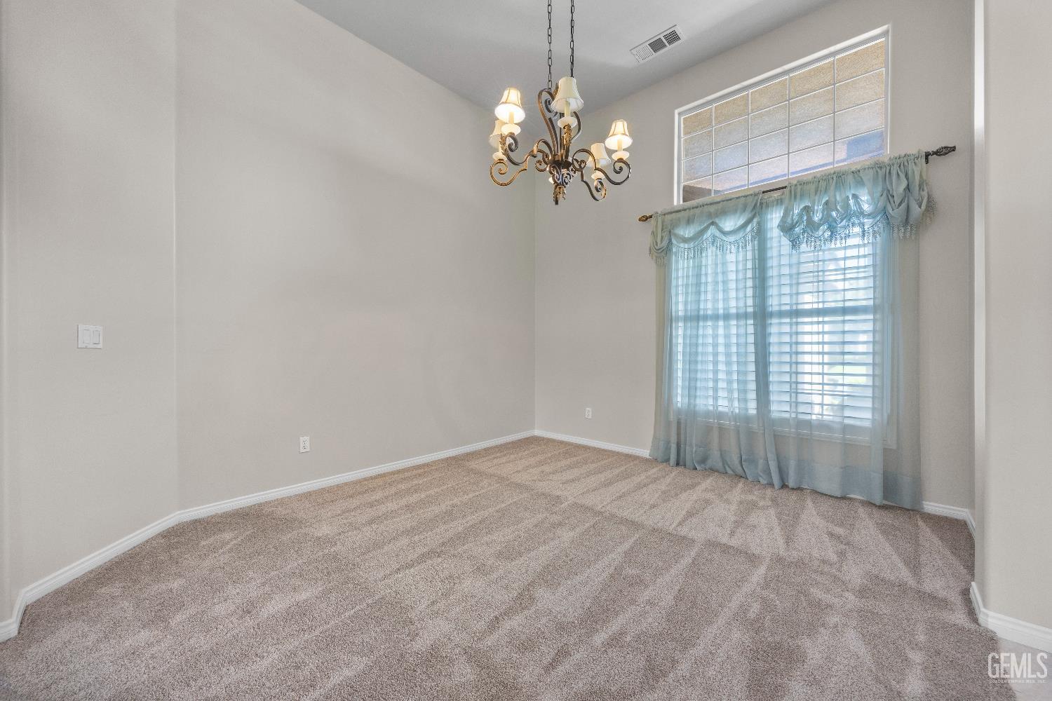 Undisclosed Address Bakersfield, CA 93312 - Photo 8 of 45 a view of livingroom with window