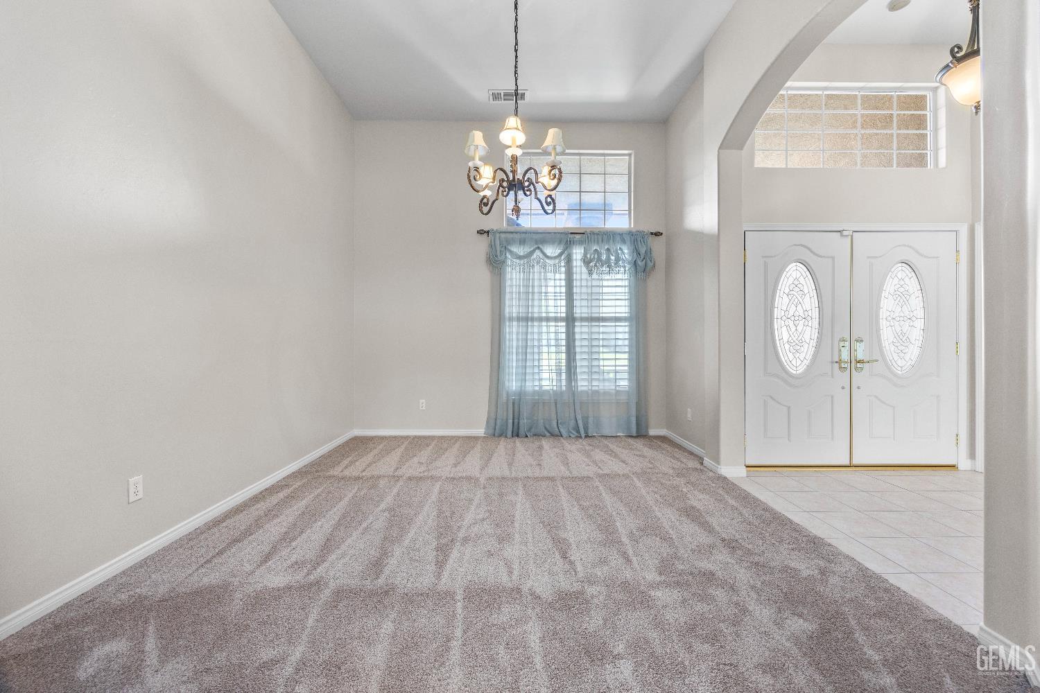 Undisclosed Address Bakersfield, CA 93312 - Photo 9 of 45 a view of an empty room with a window