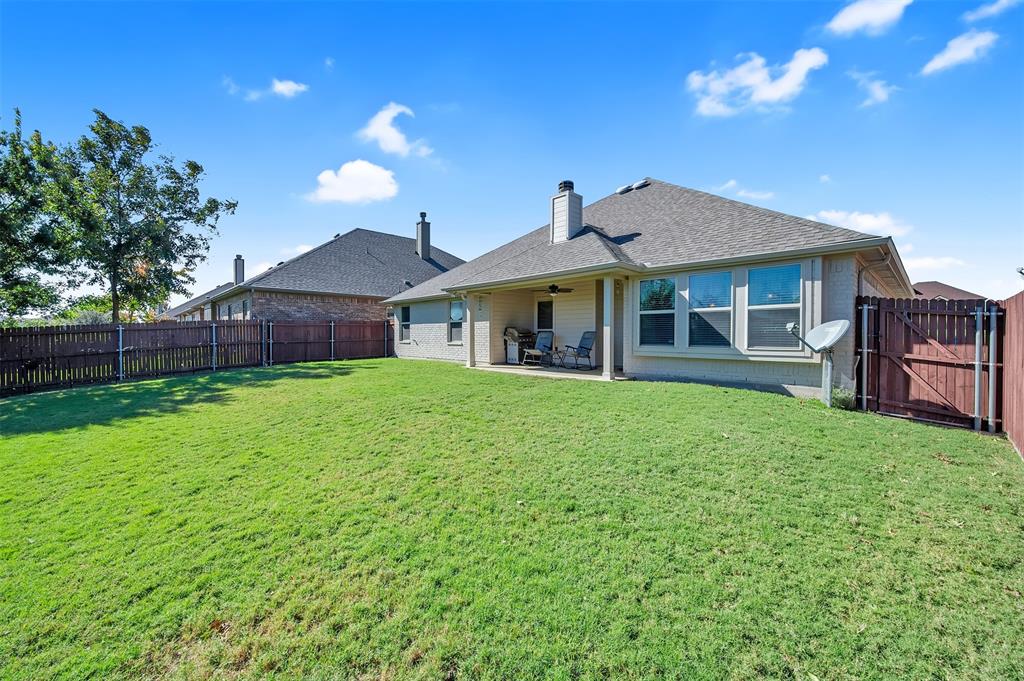 1663 Potomac Drive Burleson, TX 76028 - Photo 18 of 25 a view of a house with a backyard