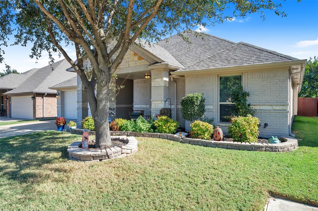1663 Potomac Drive Burleson, TX 76028 - Photo 2 of 25 a front view of house with yard and outdoor seating