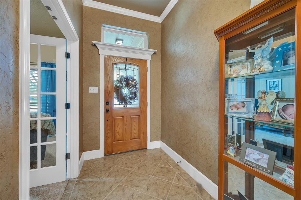 1663 Potomac Drive Burleson, TX 76028 - Photo 4 of 25 a view of an entryway with wooden floor