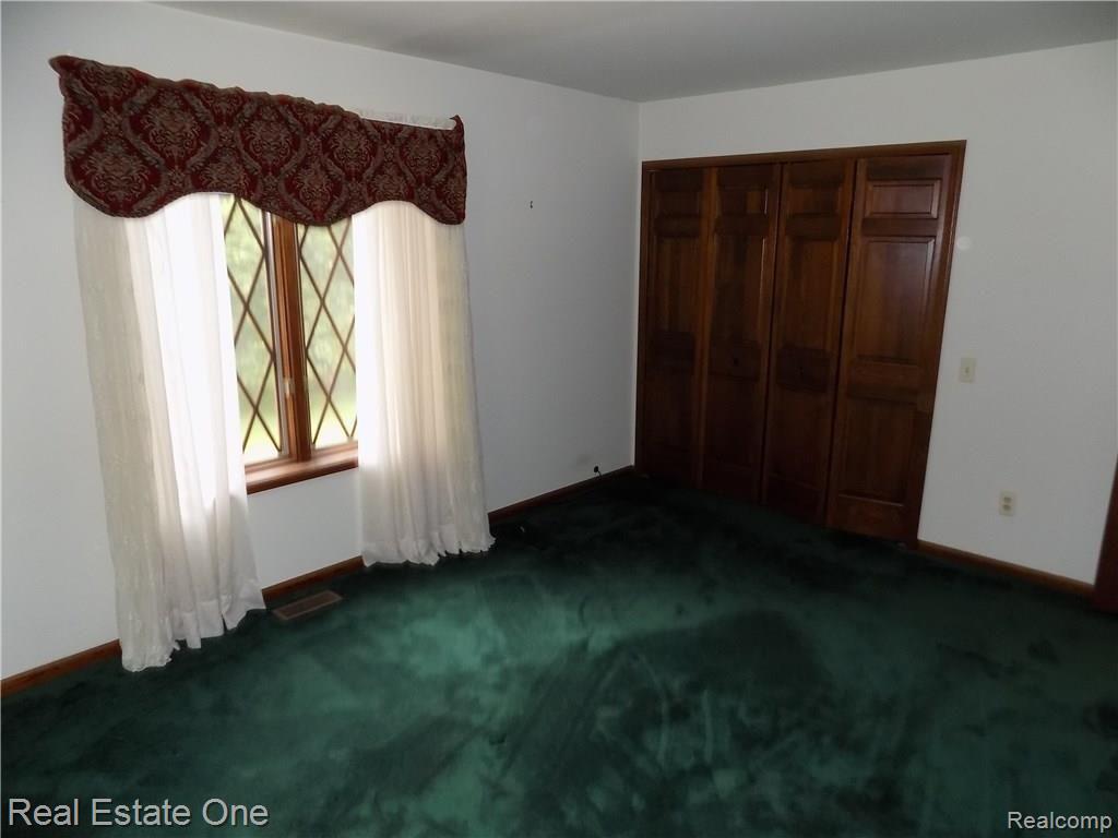 4650 Clyde Road Holly, MI 48442 - Photo 31 of 68 Second shot of one of the two bfirst floor bedrooms