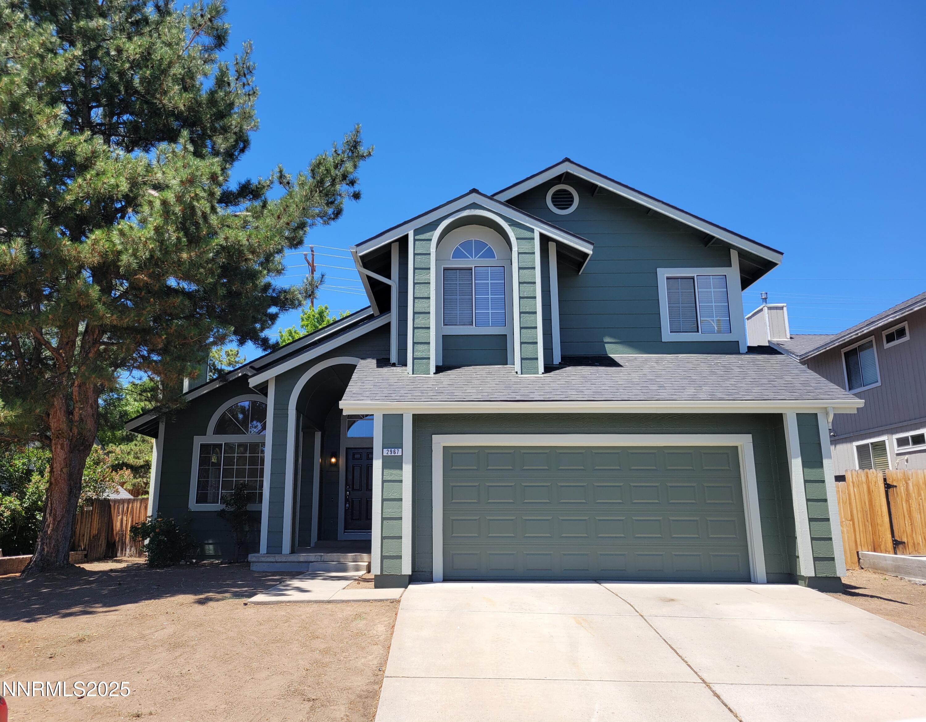 2967 Aspendale Drive Reno, NV 89503 - Photo 1 of 20 a front view of a house with a garage