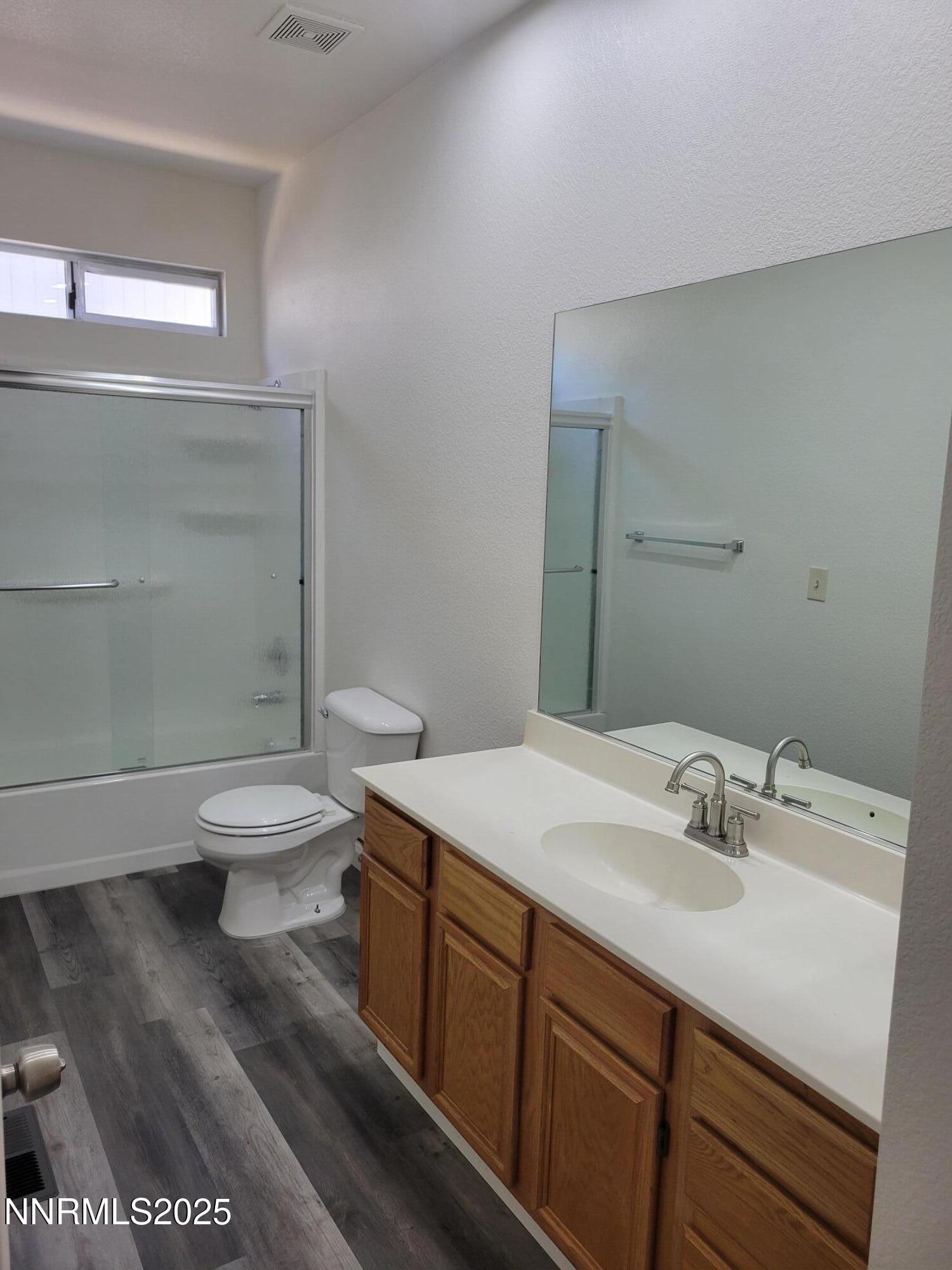 2967 Aspendale Drive Reno, NV 89503 - Photo 8 of 20 a bathroom with a sink a toilet and shower