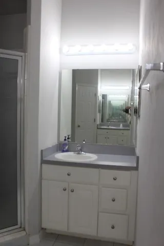 an empty room with a mirror