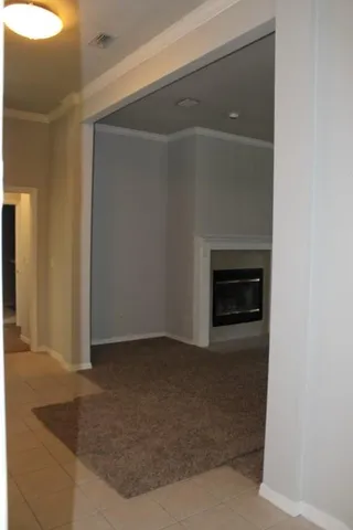a kitchen with a stove and a white cabinets