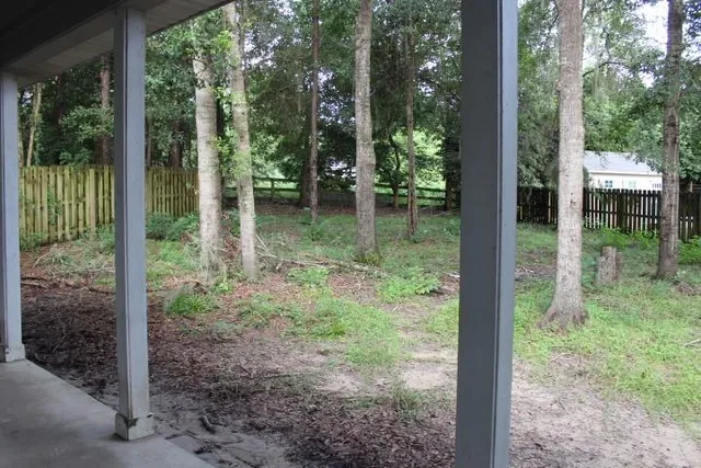 a view of staircase with white walls