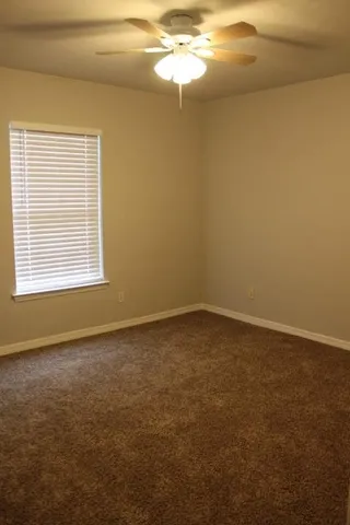 a view of a house with a large window