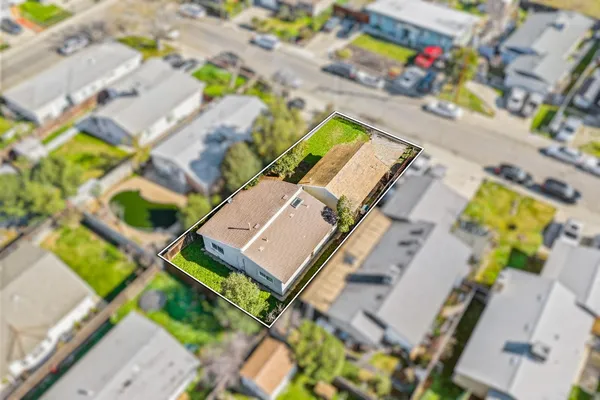 an aerial view of a house with a swimming pool