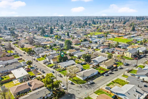 an aerial view of residential houses with swimming pool