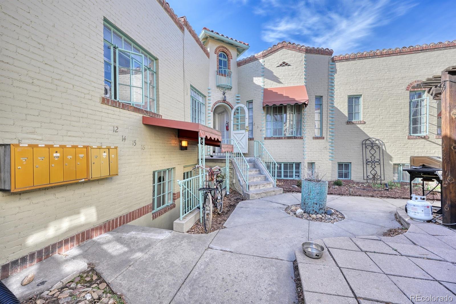 485 South Logan Street, Unit 16 Denver, CO 80209 - Photo 13 of 14 a front view of a house with chairs