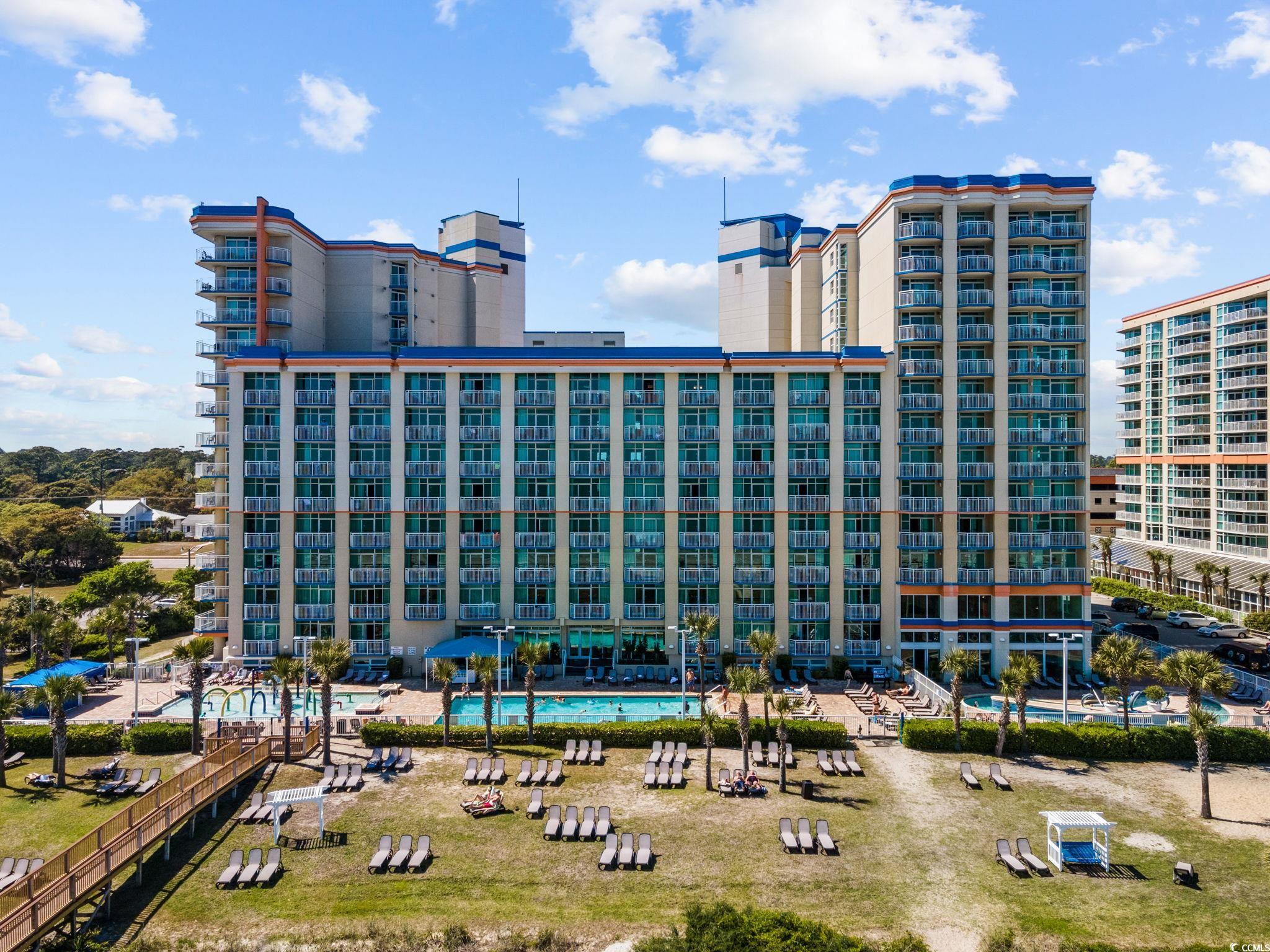 View of property featuring a community pool