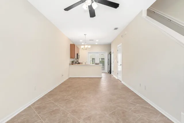 a view of a hallway with a kitchen