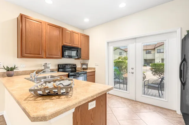 a kitchen with a stove a sink and a microwave