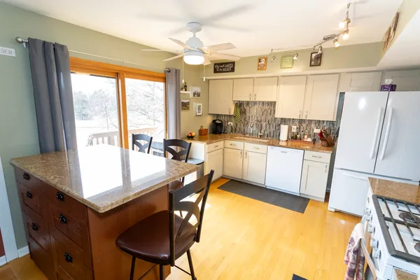 a very nice looking kitchen with a large window