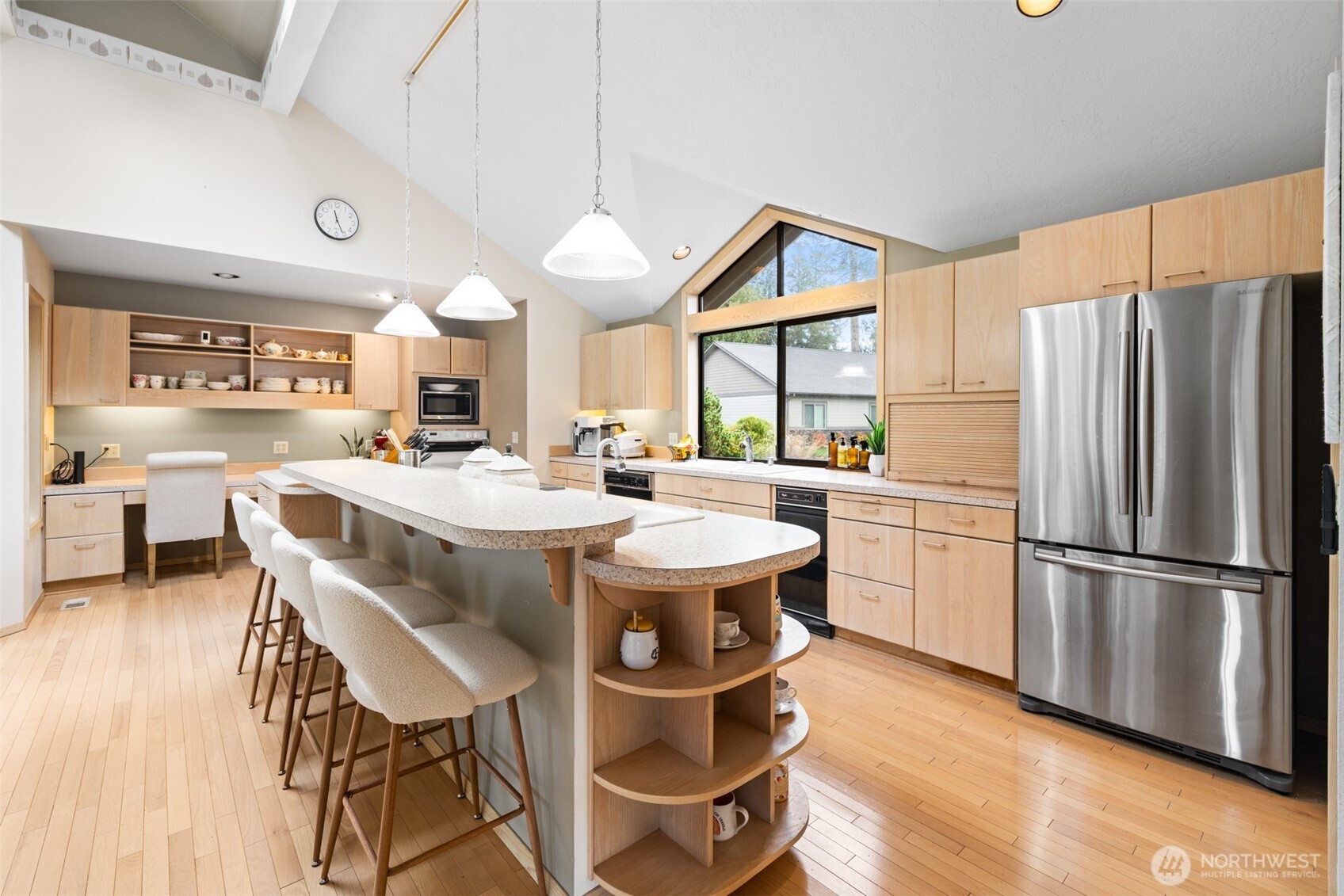 117 Williams Place Sequim, WA 98382 - Photo 11 of 40 a kitchen with stainless steel appliances a table chairs refrigerator and a sink