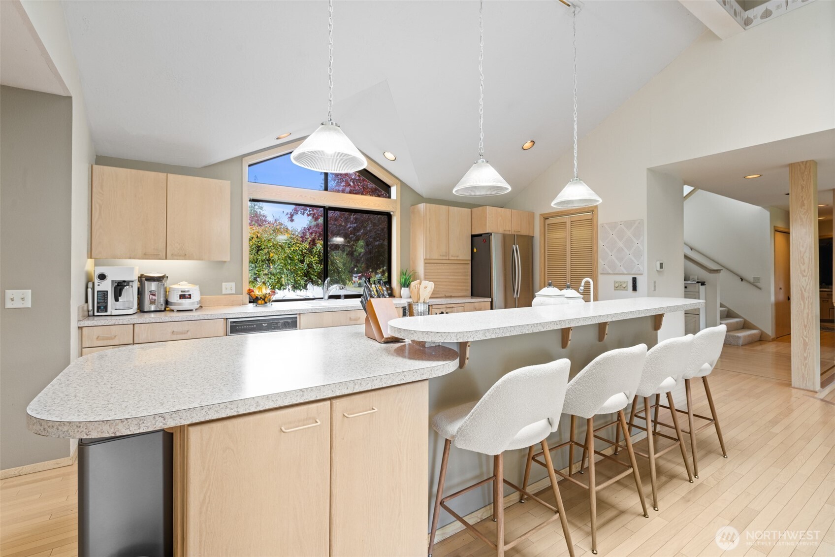 117 Williams Place Sequim, WA 98382 - Photo 12 of 40 a kitchen with a table chairs stove and cabinets