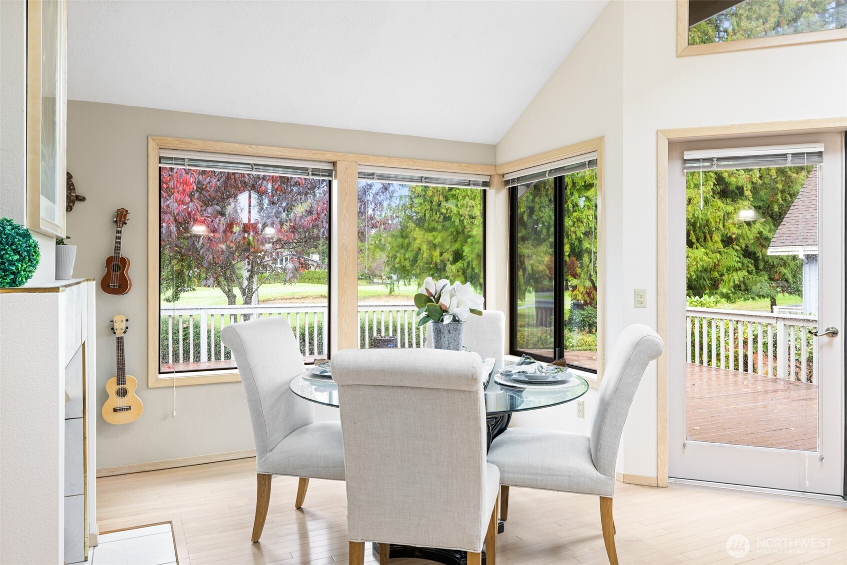 117 Williams Place Sequim, WA 98382 - Photo 13 of 40 a view of a dining room with furniture large windows and wooden floor