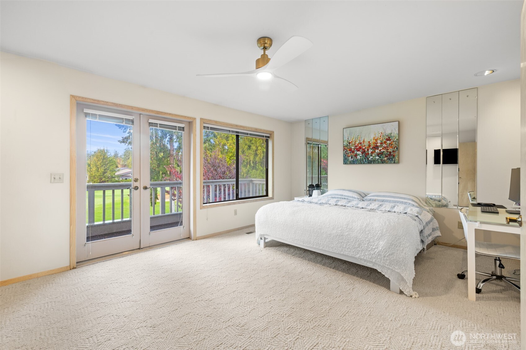117 Williams Place Sequim, WA 98382 - Photo 17 of 40 a spacious bedroom with a large bed and a large window