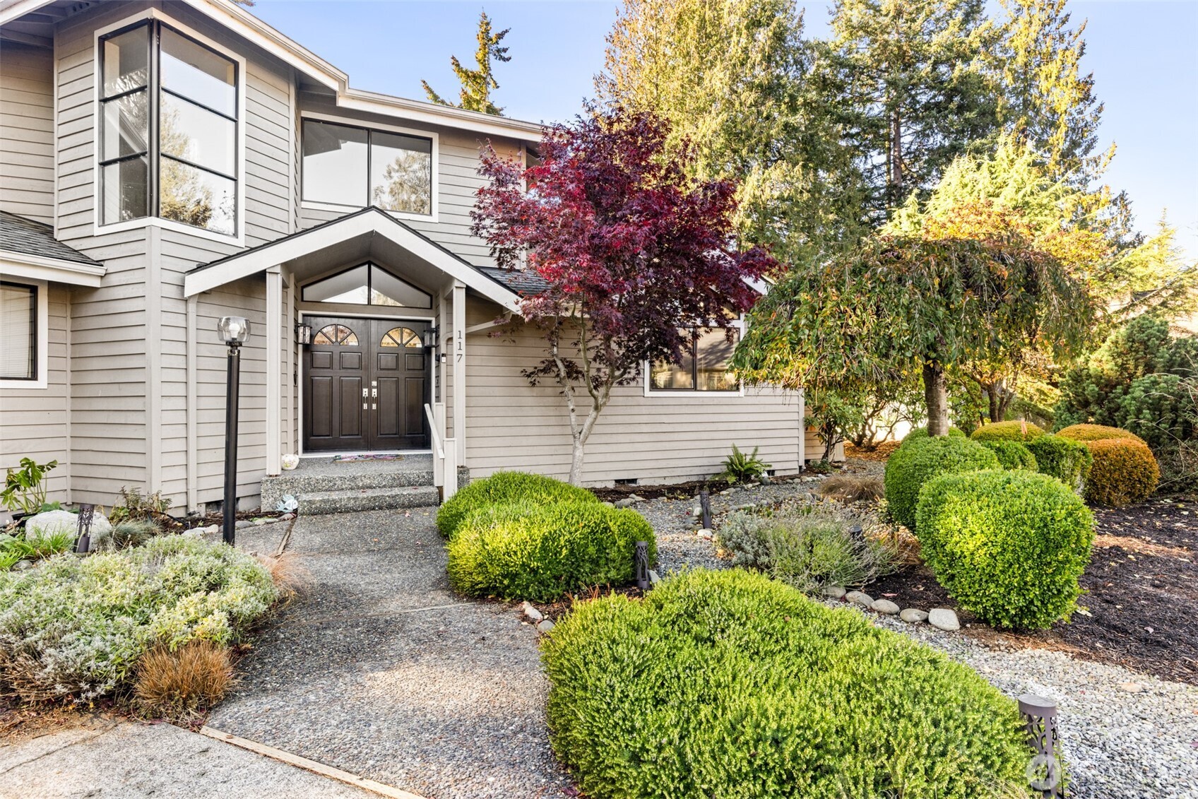 117 Williams Place Sequim, WA 98382 - Photo 2 of 40 a front view of a house with garden