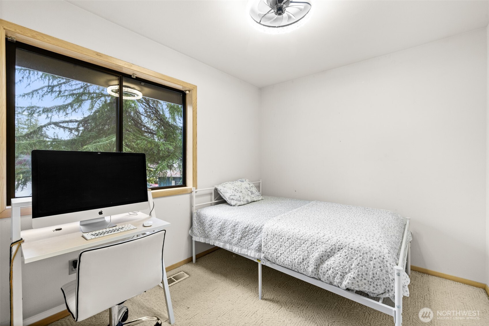 117 Williams Place Sequim, WA 98382 - Photo 21 of 40 a bedroom with a bed and a flat screen tv