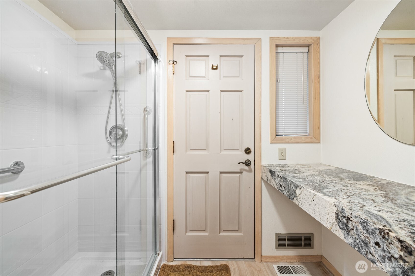 117 Williams Place Sequim, WA 98382 - Photo 23 of 40 a bathroom with a granite countertop sink and a mirror