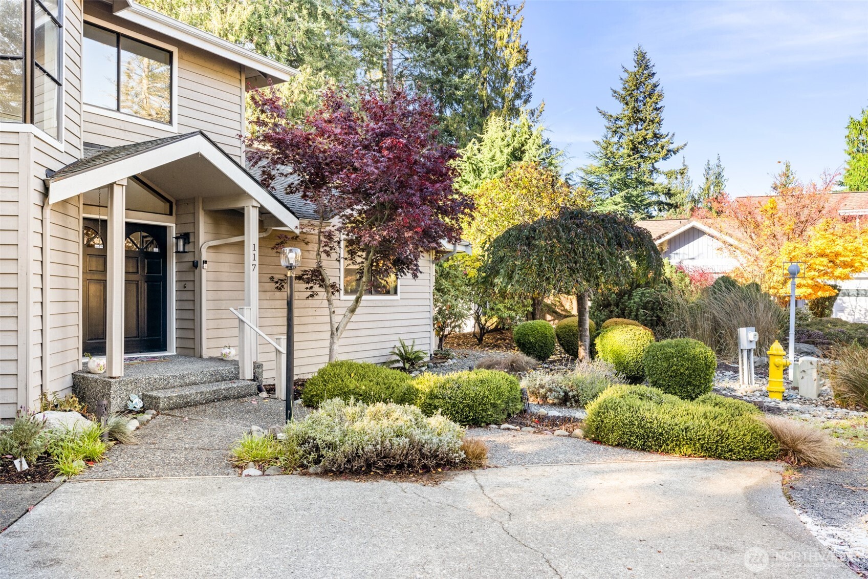 117 Williams Place Sequim, WA 98382 - Photo 3 of 40 a front view of a house with a yard and potted plants