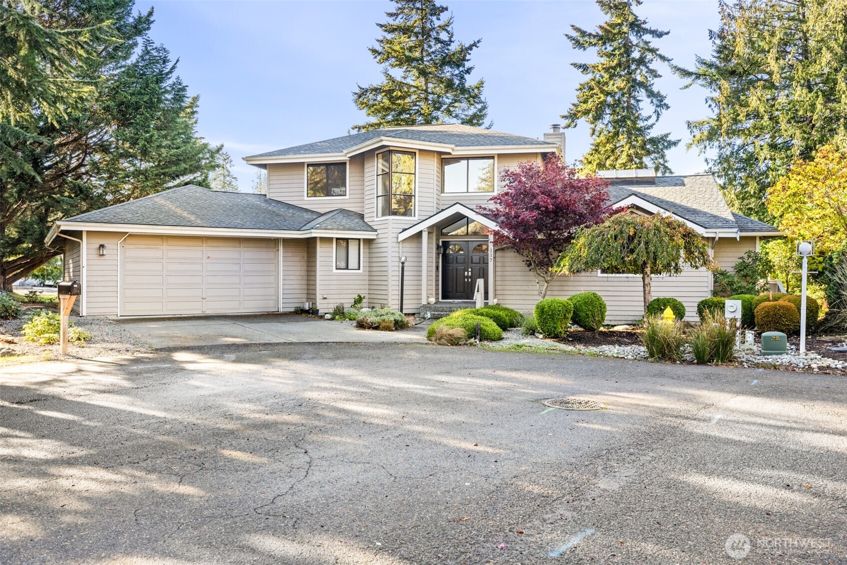 117 Williams Place Sequim, WA 98382 - Photo 37 of 40 a front view of a house with a garden