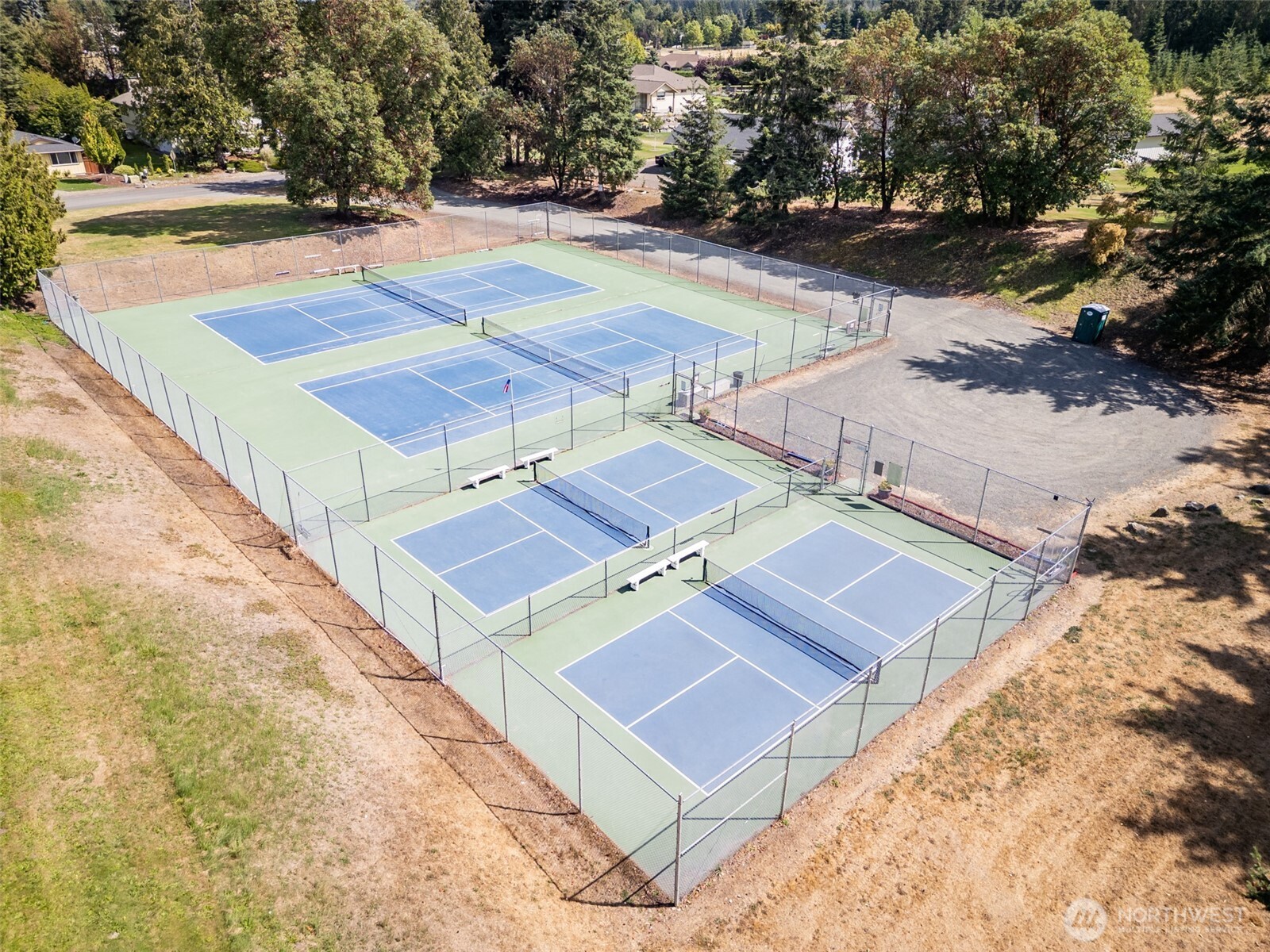 117 Williams Place Sequim, WA 98382 - Photo 39 of 40 a view of a tennis ground with large trees