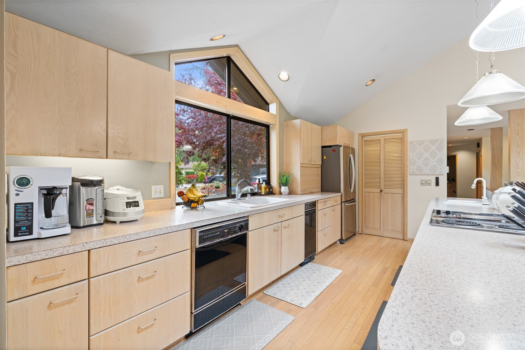 117 Williams Place Sequim, WA 98382 - Photo 9 of 40 a large kitchen with a lot of counter space and a sink