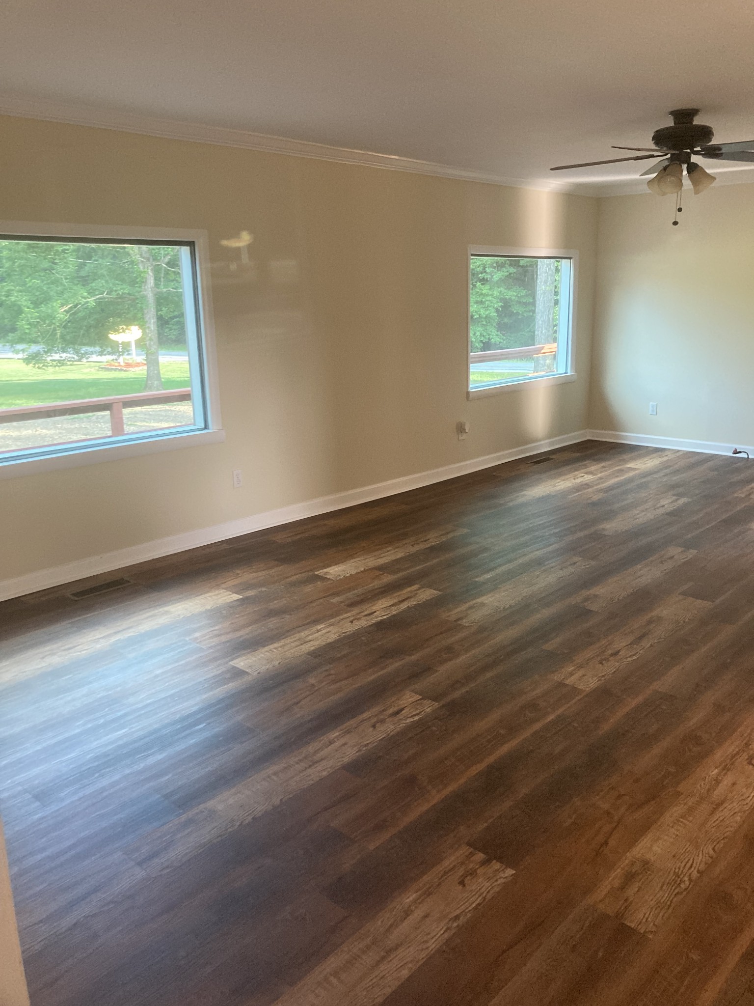 4516 Mansford Road Winchester, TN 37398 - Photo 12 of 53 an empty room with wooden floor and windows