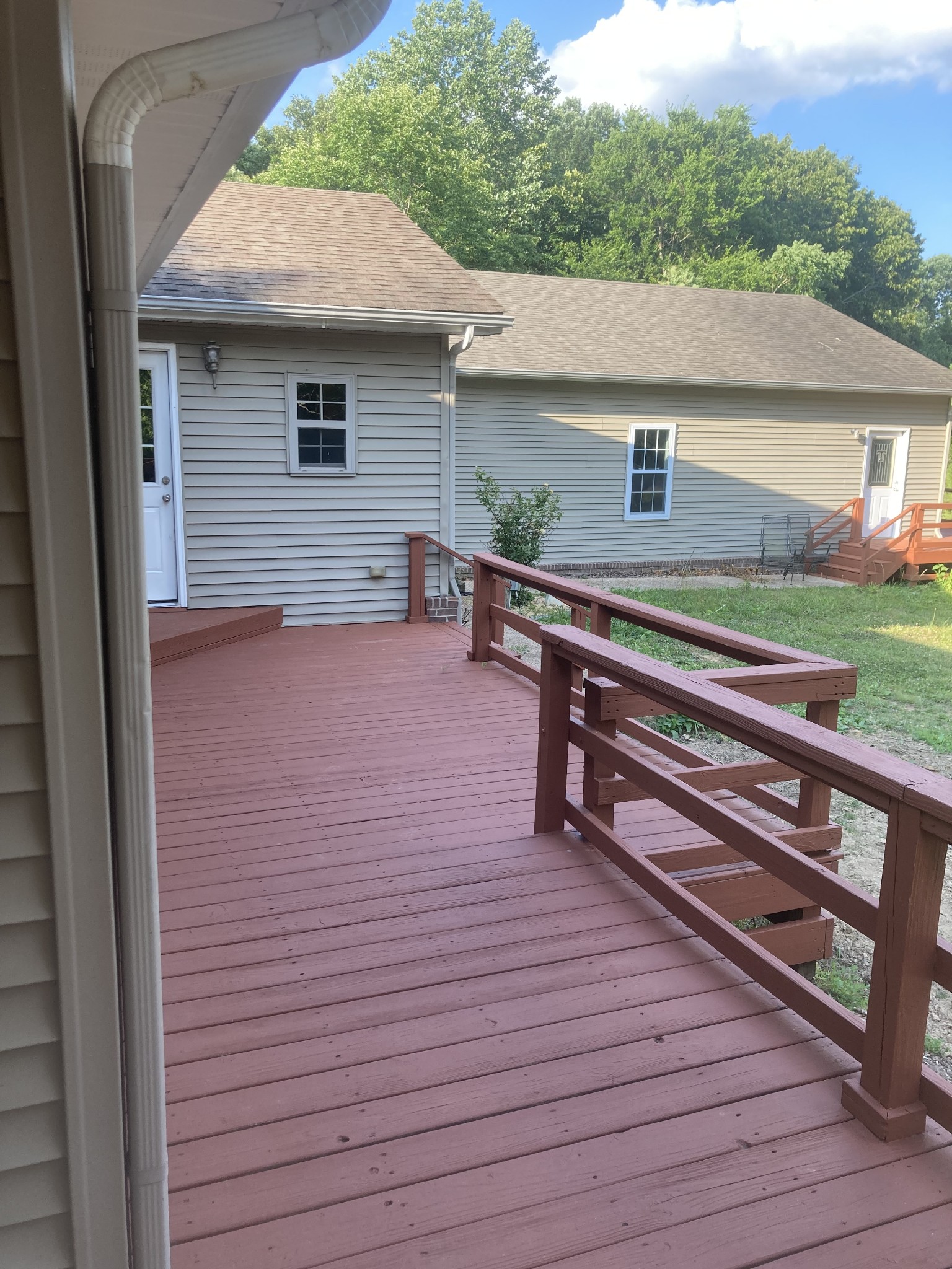 4516 Mansford Road Winchester, TN 37398 - Photo 18 of 53 a backyard of a house with wooden floor and outdoor seating