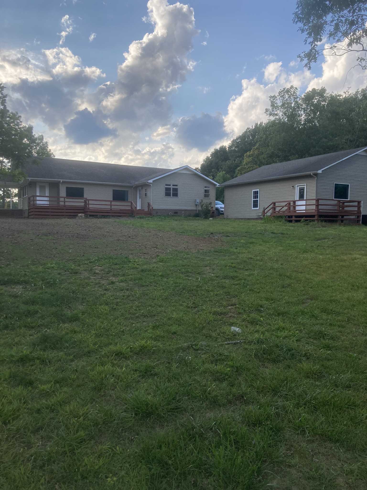 4516 Mansford Road Winchester, TN 37398 - Photo 26 of 53 a view of a big house with a big yard potted plants and large tree
