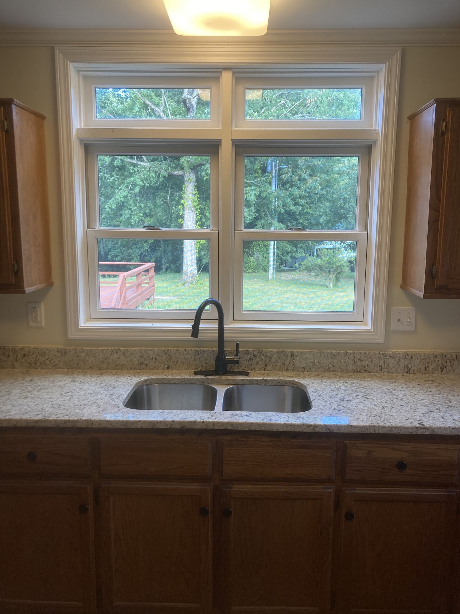 4516 Mansford Road Winchester, TN 37398 - Photo 36 of 53 a kitchen with granite countertop a sink and a window