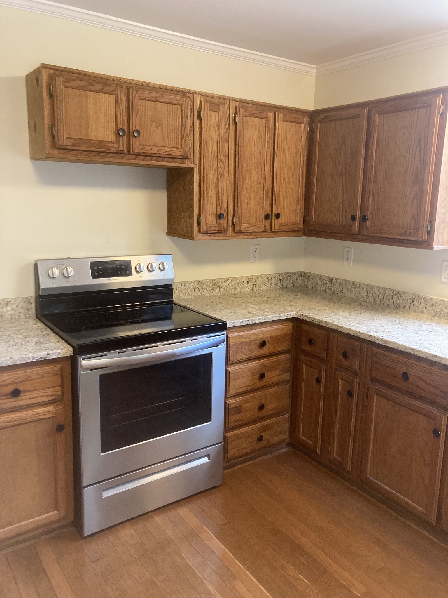 4516 Mansford Road Winchester, TN 37398 - Photo 37 of 53 a kitchen with granite countertop a stove microwave and cabinets