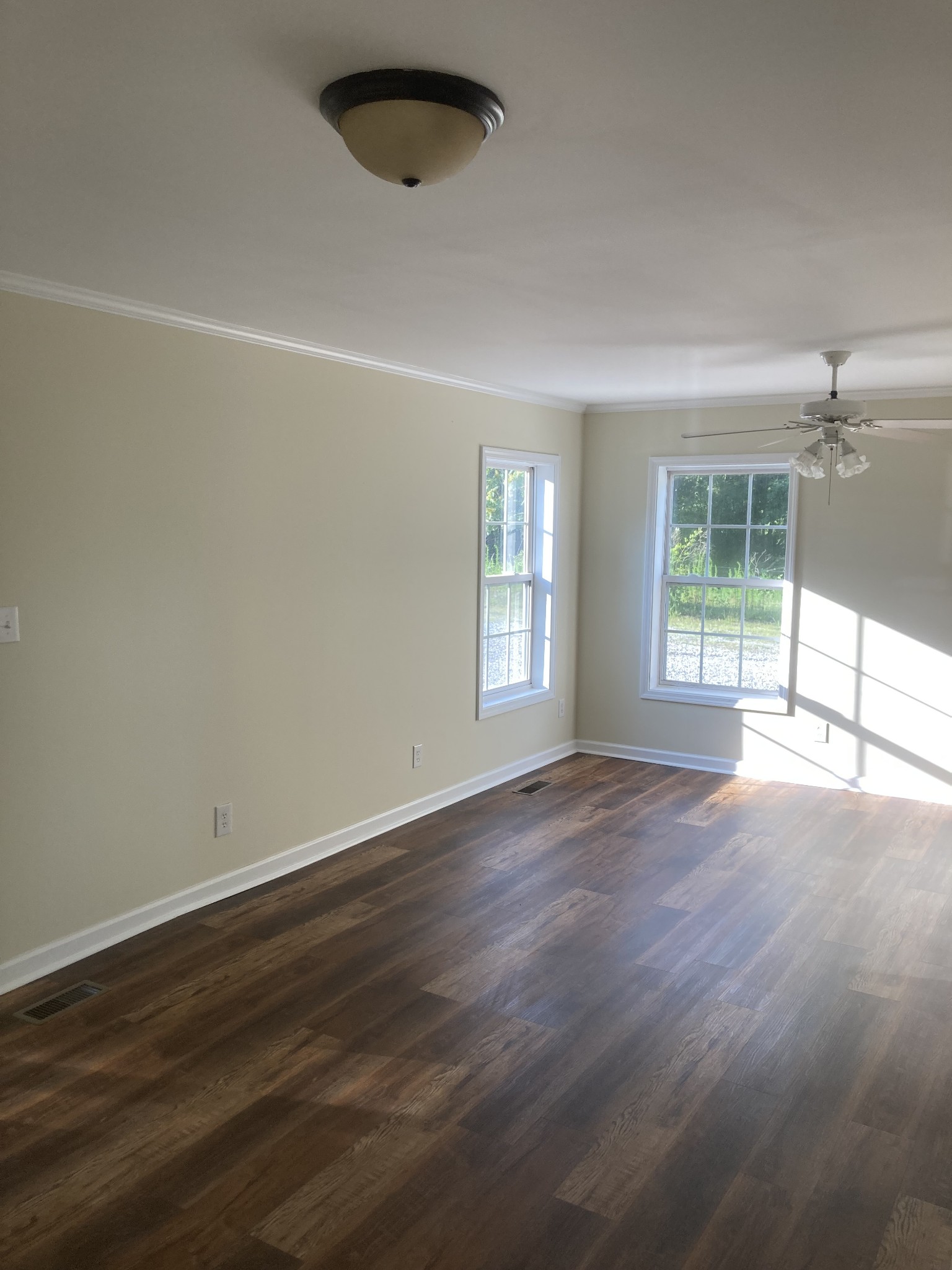 4516 Mansford Road Winchester, TN 37398 - Photo 39 of 53 an empty room with wooden floor and windows