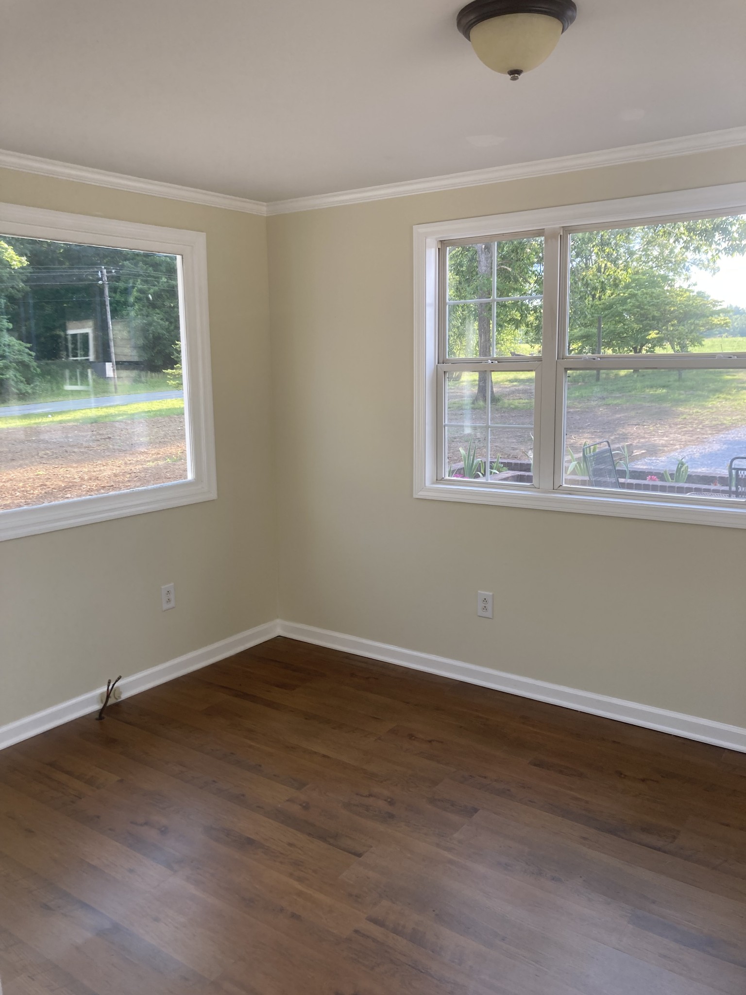 4516 Mansford Road Winchester, TN 37398 - Photo 40 of 53 an empty room with wooden floor and a window