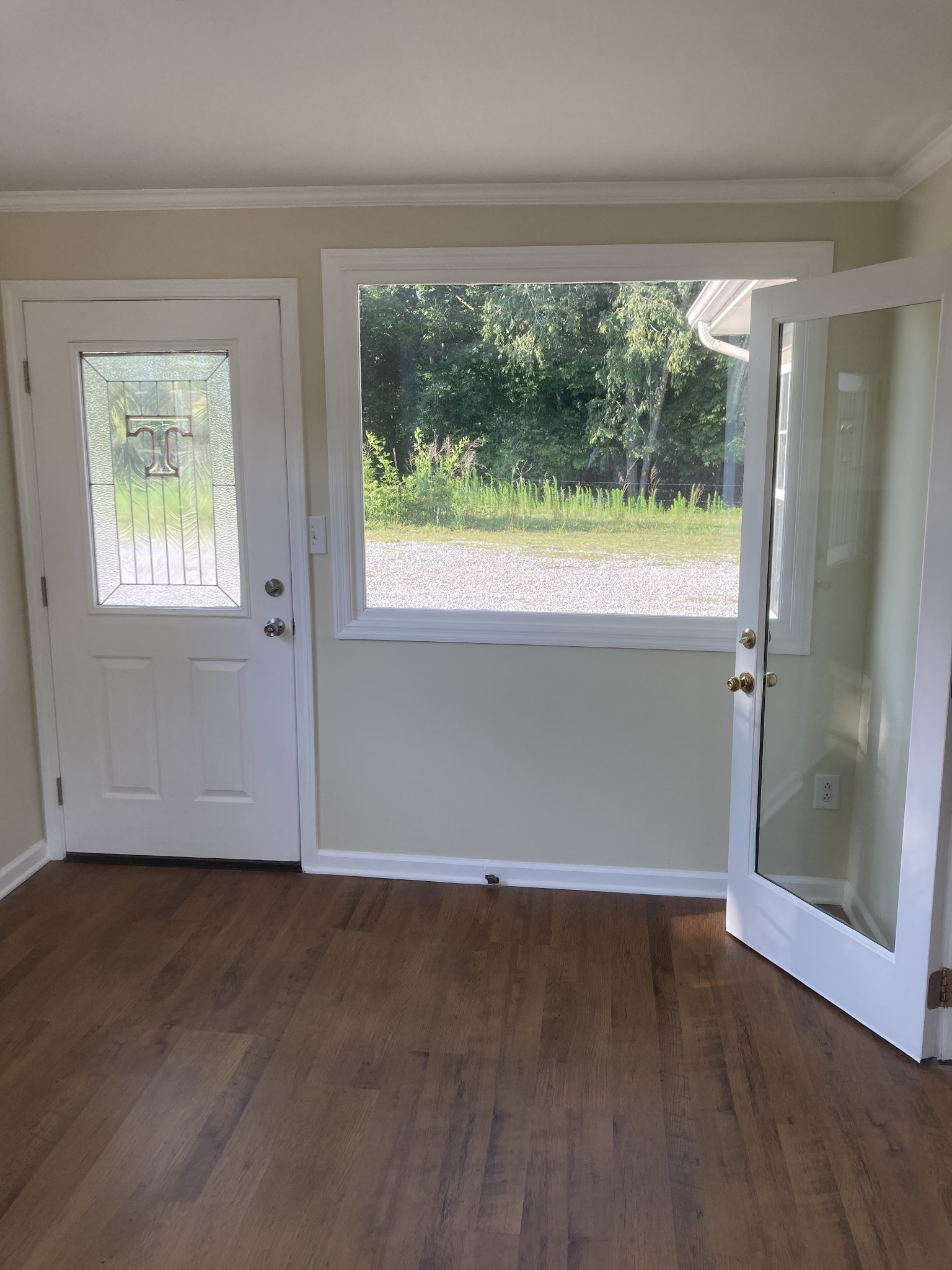 4516 Mansford Road Winchester, TN 37398 - Photo 41 of 53 an empty room with wooden floor and a window