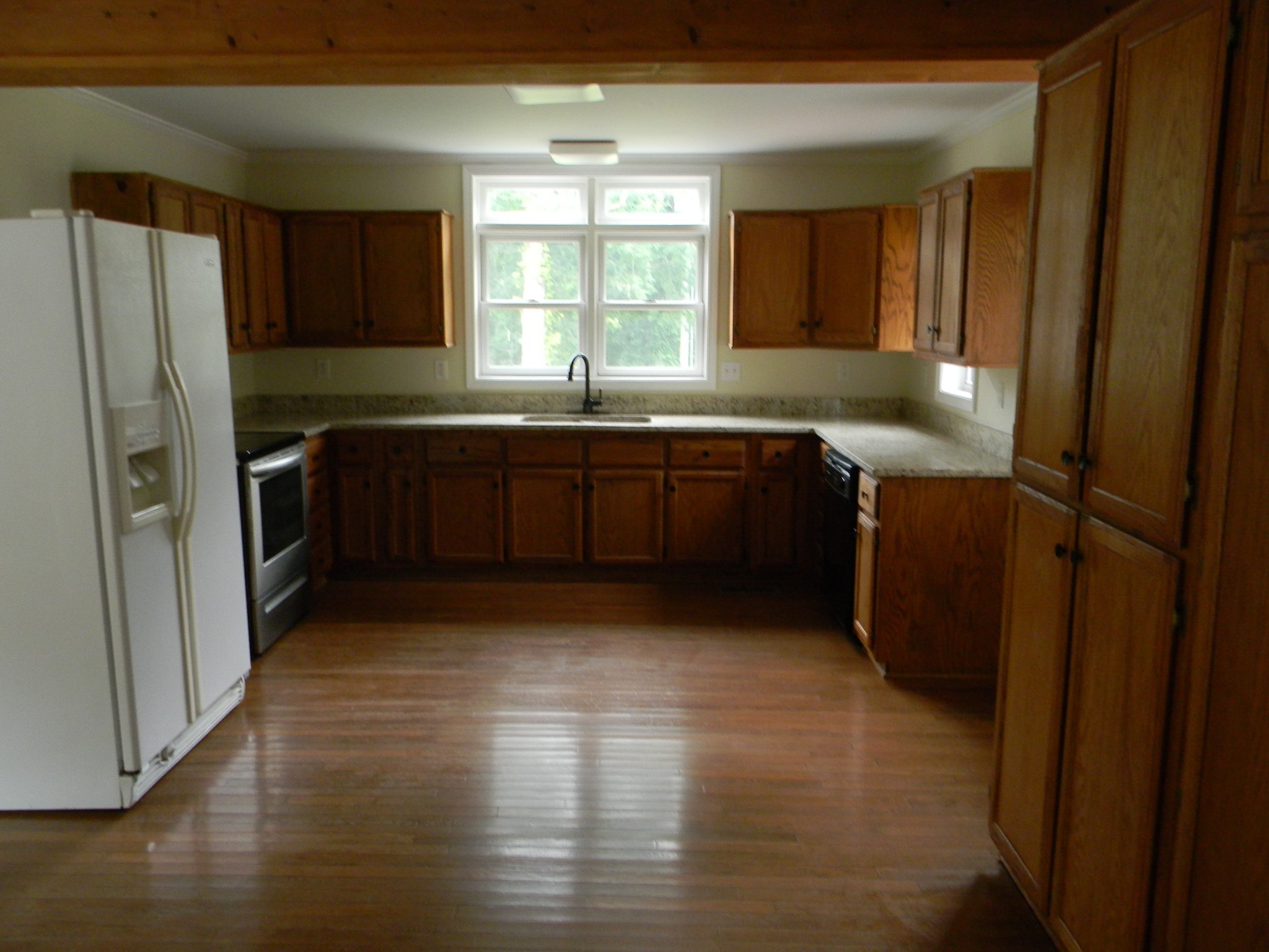4516 Mansford Road Winchester, TN 37398 - Photo 45 of 53 a kitchen with stainless steel appliances granite countertop a refrigerator and a sink