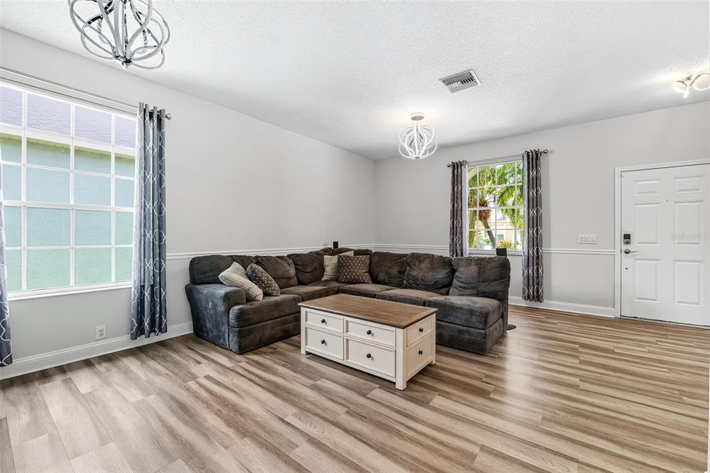 10443 Peppergrass Court Trinity, FL 34655 - Photo 19 of 62 a living room with furniture and a window
